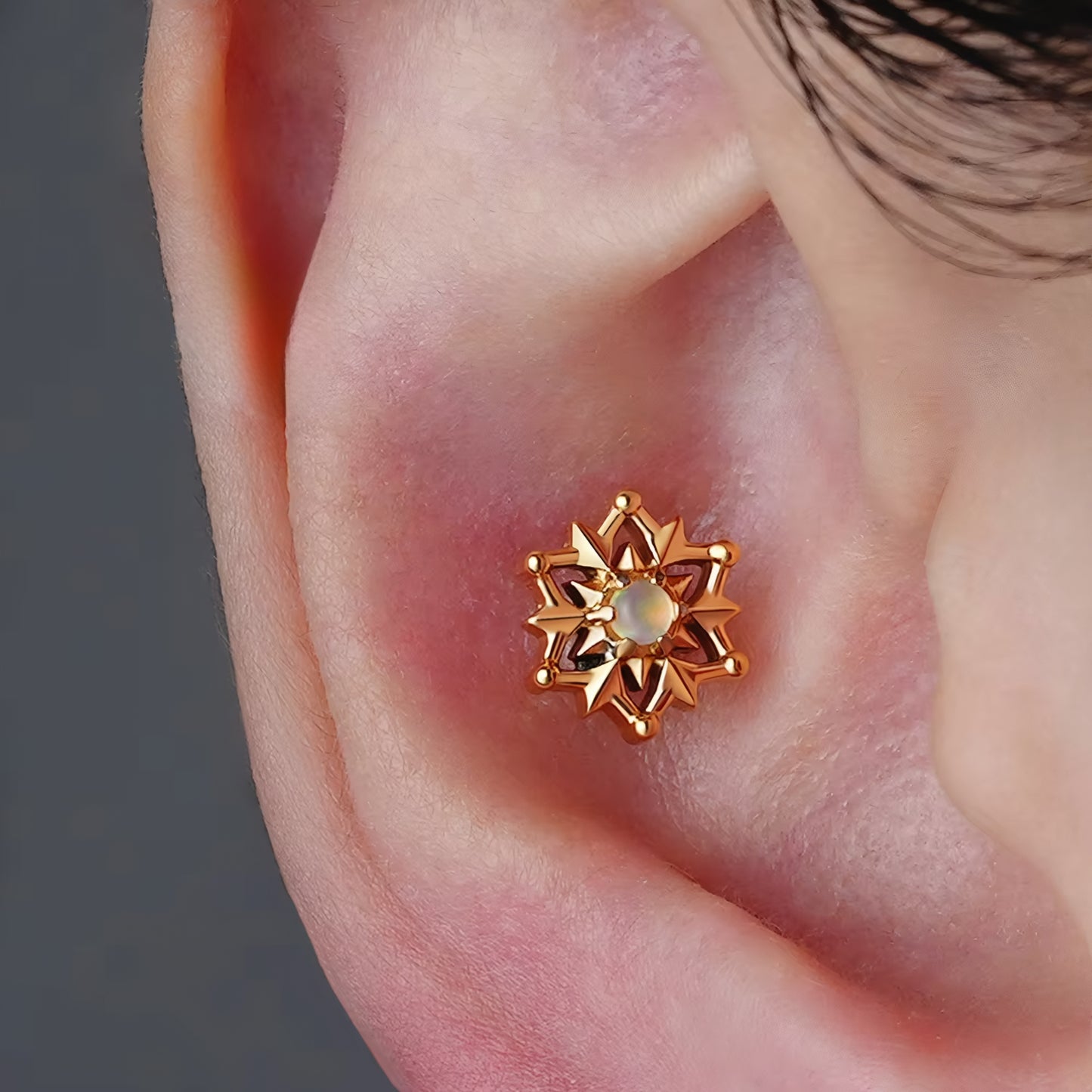 Titanium Tribal Sun Flat Ear Piercing